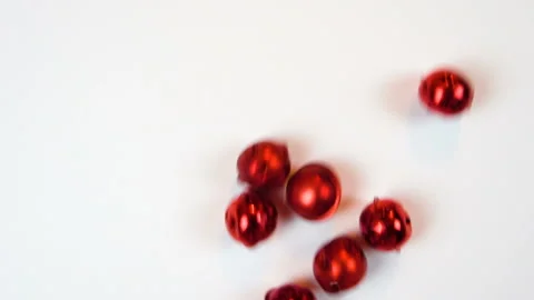 Red bells on white background slow Stock Footage 101492381