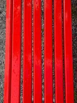 Red bench with drops Stock Photos
