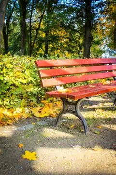 Red bench in the park in Autum.n Stock Photos