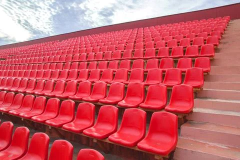 Red benches in the stadium Stock Photos