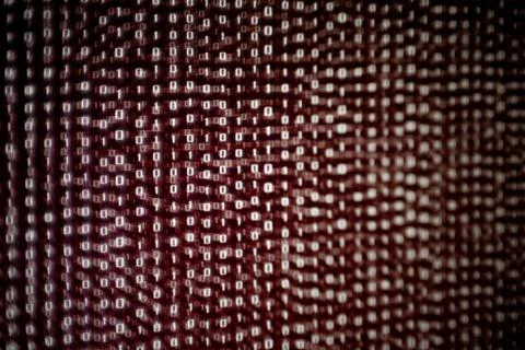 Red binary code background. dangerous virus infection internet connection. co 写真素材