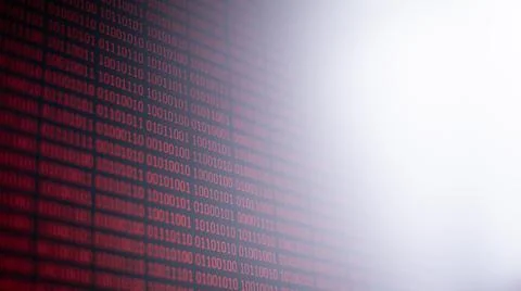 Red binary code on computer screen with glow for inscription Foto stock