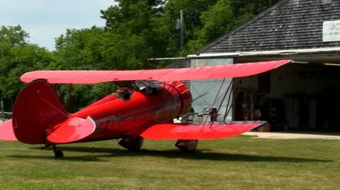 Red biplane engine warmup Stock Footage 12332029