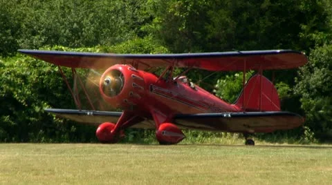 Red biplane runway Stock Footage 12332281