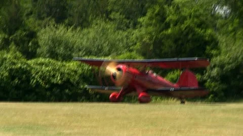 Red biplane runway Stock Footage 12332484