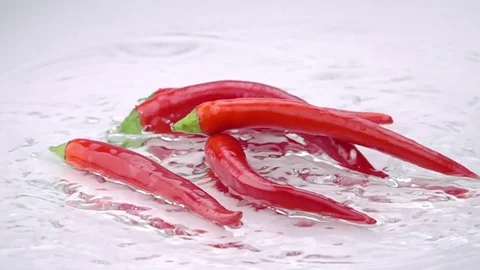 Red Bitter Cayenne Falls on the Table. Stock Footage 72965683