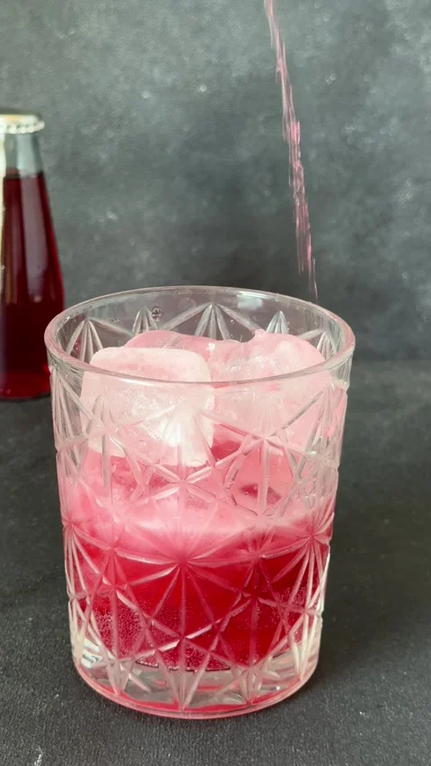Red bitter glass bottle aperitif portioned sparkling aperitif drink glass Stock Footage 330424043