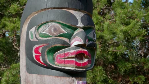 Red, Black and Green Face Paint, Native Indian Totem Pole Wooden Carving Stock Footage 162420340