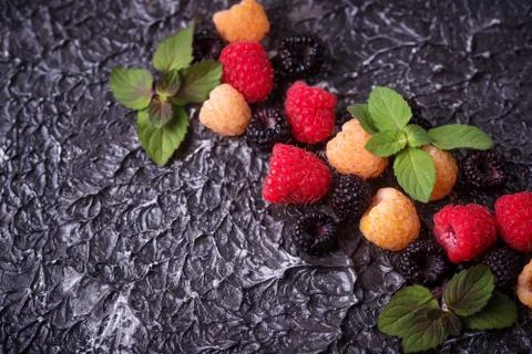 Red, black and yellow raspberry Stock Photos