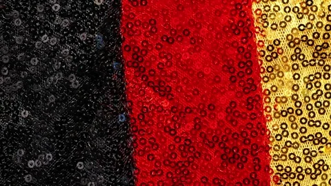 Red black gold  shiny texture.German national colors. Stock Footage 342842495