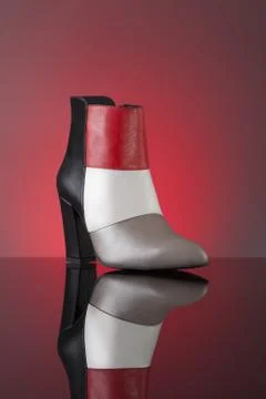 Red-black-grey ankle boot Stock Photos