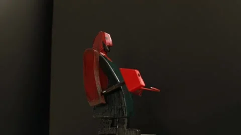 Red blacksmith swinging a heavy hammer stop motion Stock Footage 297208893
