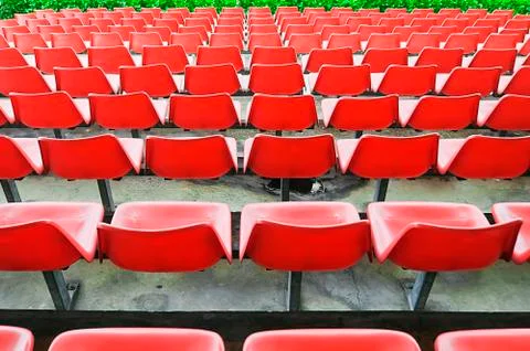 Red bleacher seats Foto stock
