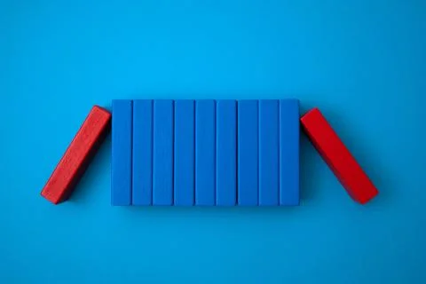Red block blocking blue blocks. Stock Photos