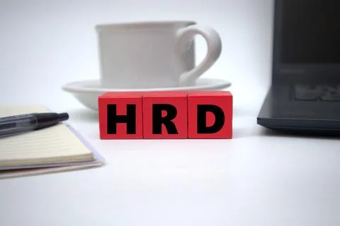 The red block says HRD in front of a cup of coffee Stock Photos
