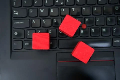 Red blocks on a black laptop Stock Photos