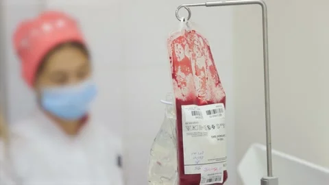 The red blood cells in container on the stand Stock Footage 234815158