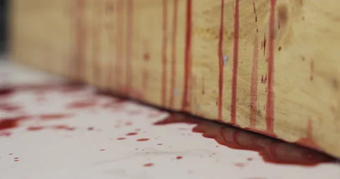Red blood liquid dripping down a wooden wall, Halloween concept. Video stock 143250152