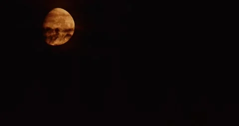 Red Blood Moon Rising Through Dark Clouds Night Timelapse Stock Footage 331951671