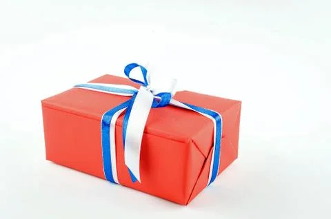 Red, blue and white gift boxes with ribbons on a white background Stock Photos