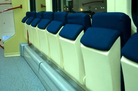 Red blue comfortable seats on the train Stock Photos
