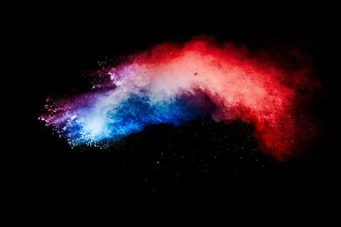 Red blue dust particles explosioon on black background.Red blue powder splash Stock Photos