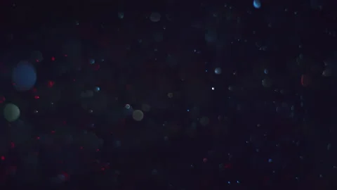 Red Blue green High Density Macro Particles isolated on Black Background Stock Footage 192781818