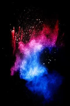 Red blue powder explosion cloud on black background.Launched blue dust part.. Stock Photos