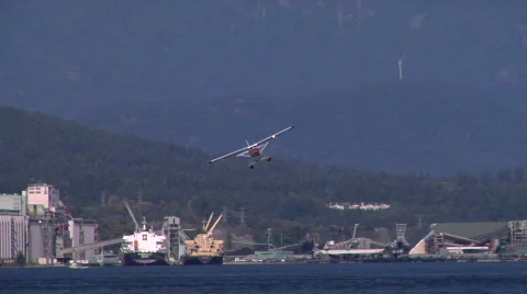 Red Blue White Float Plane Lands Stock-Footage 827432