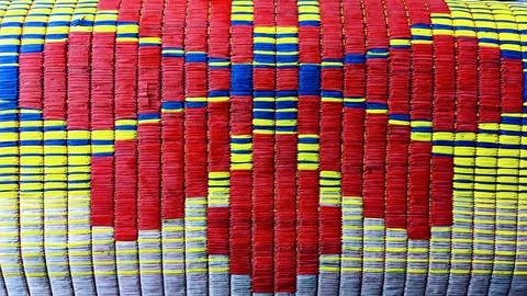 Red Blue Yellow Heart Pattern Woven Mat 스톡 사진