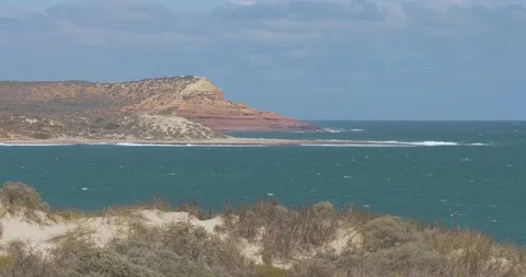 Red bluff and Jakes Point shot over the bay in kalbarri Stock Footage 88406774