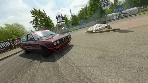 Red BMW Qualifying Run Captured in Dynamic Low FPV Flight Stock Footage 322973230