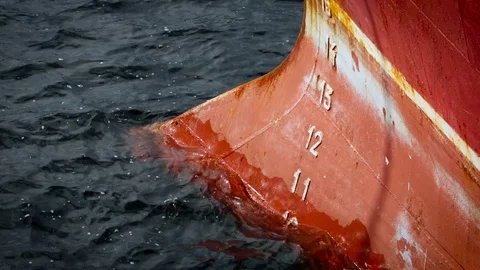 Red Boat Basement. Sea Waves Washing Its Iron Surface. Dark Water. Close up Stock Footage 73920437