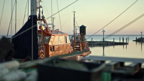 Red boat in dock at sunset Stock Footage 253579534