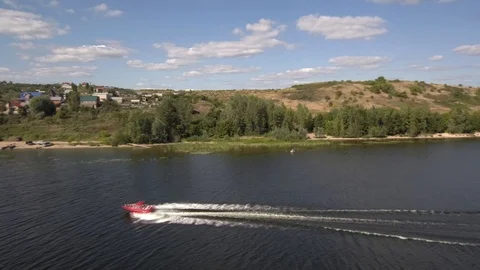 Red boat floating on the river. Stock Footage 94905888