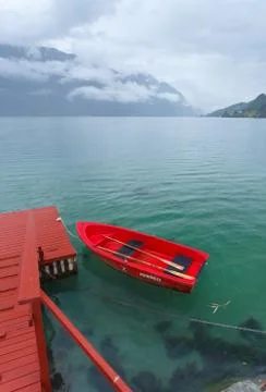 Red boat with reflection Stock Photos