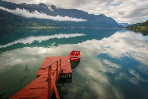 Red boat with reflection Stock Photos
