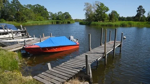 Red boat in summer landscape Stock Footage 94367402