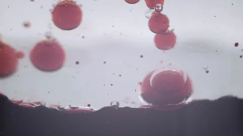 Red body burst on the surface Stock Footage 105861494
