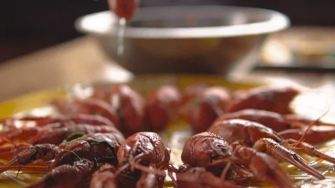 Red boiled crayfish on a platter. Close-up Chef puts crayfish on a huge plate Video stock 103204300
