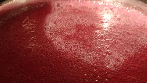 Red boiling liquid. Raspberry drink. Preparation of the drink. Stock Footage 307211461
