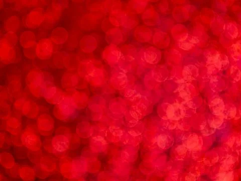 Red bokeh abstract background with soft circular light spots Stock Photos