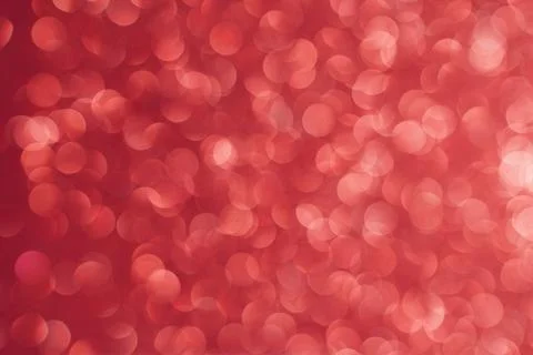 Red bokeh background. Texture foil and blurred confetti, light of golden dust Foto stock
