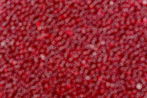 Red bokeh on a dark background. Stock Photos
