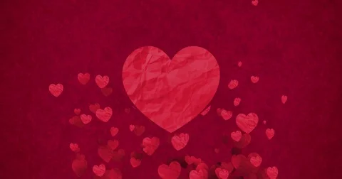 Red bokeh hearts shape of crumpled paper flowing with big heart in center Video stock 73000696