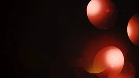 Red bokeh light effect abstract background, animation of sparkle circles Stock Footage 125636906