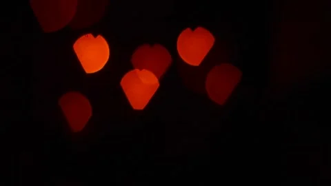 Red bokeh in the shape of a heart. Stock Footage 236420796