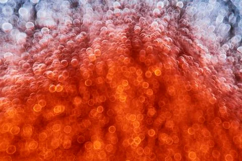 Red bokeh texture background. Abstract defocused circles. Stock Photos
