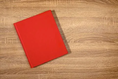 Red book on the brown pine table Stock Photos