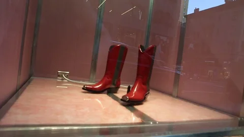 Red boots in a shop window Stock Footage 105026457